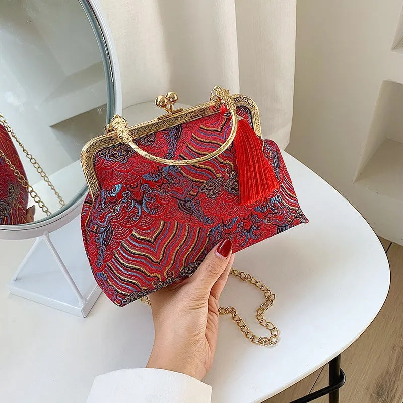Chinese embroidery cheongsam handbag in polyester with shell shape and internal zipper compartment