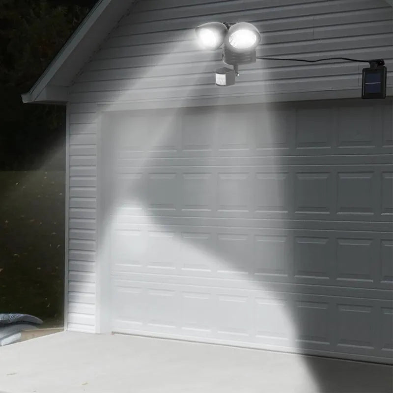 Black and white dual head solar motion sensor spotlight for outdoor wall mounting with adjustable brightness