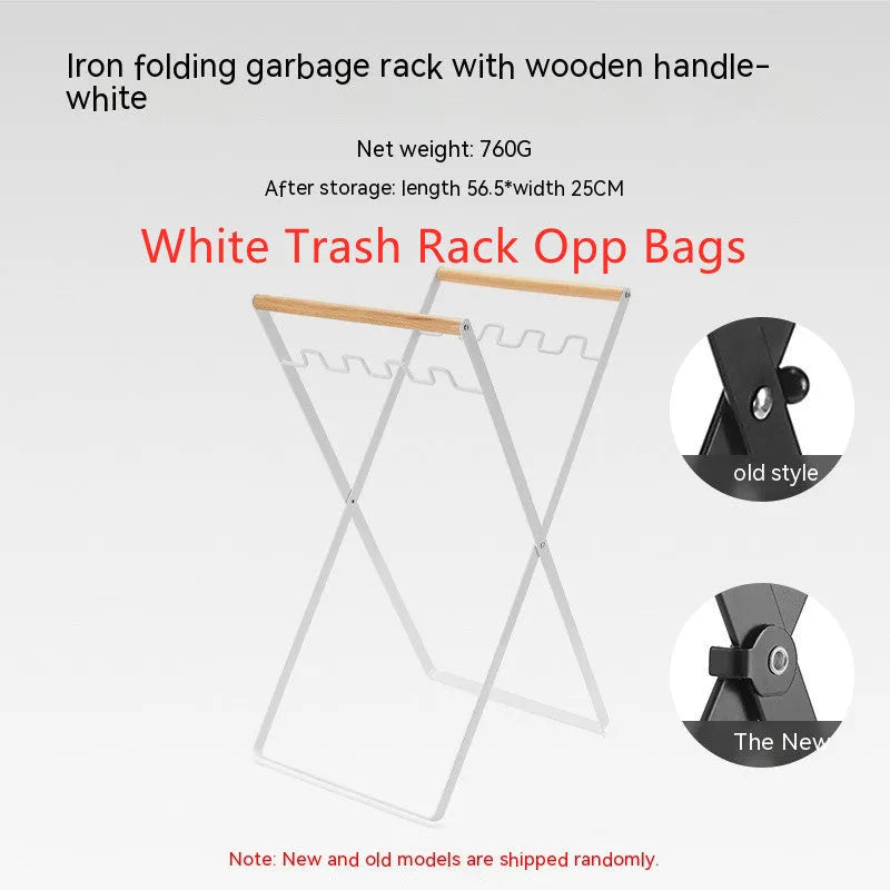 Black iron folding trash storage rack with a wooden handle for hanging bin bags.