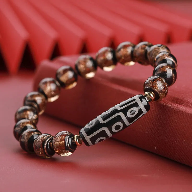 Chinese-style five-colour lucky snake bead bracelet made from coloured glaze, showing auspicious patterns.
