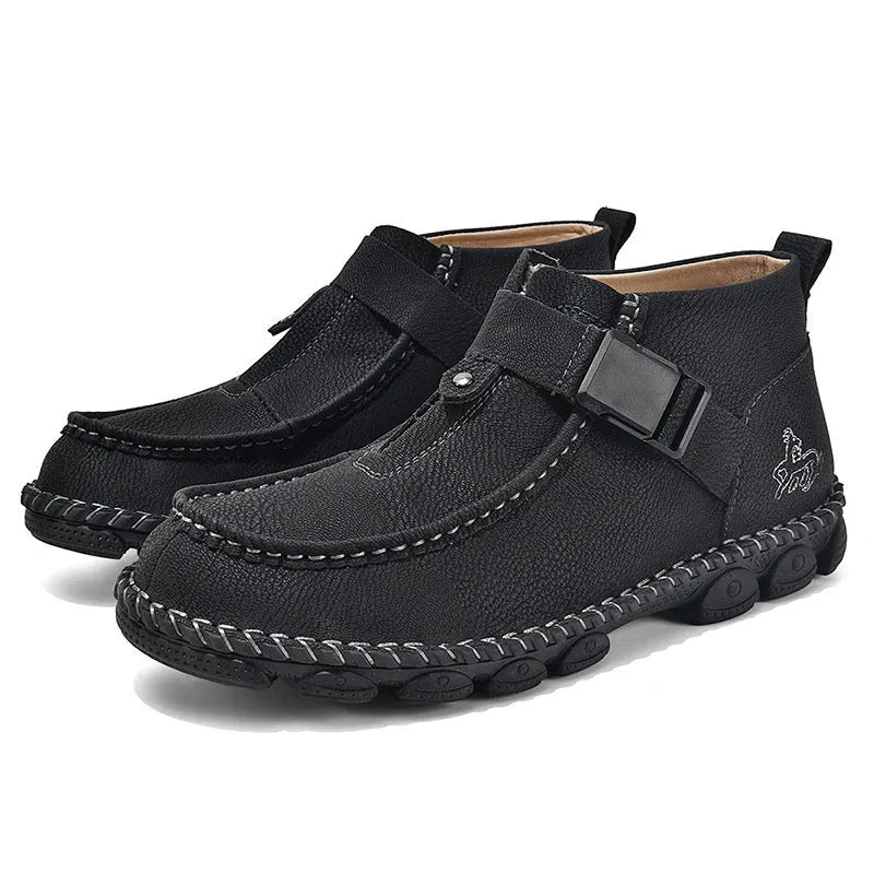 Casual flat slip-on shoes in black synthetic PU leather with visible handmade stitching around the sole.