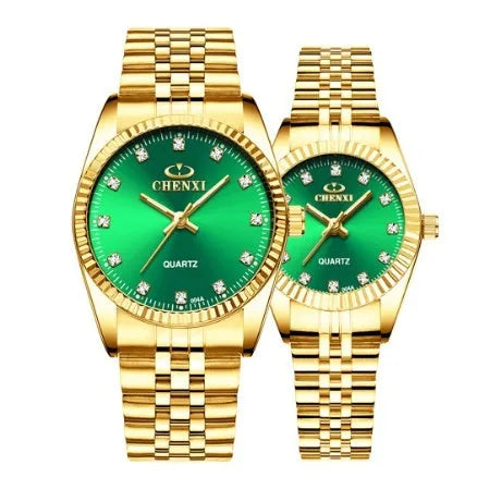 Gold men's quartz wristwatch with stainless steel strap and mineral glass display on a white surface