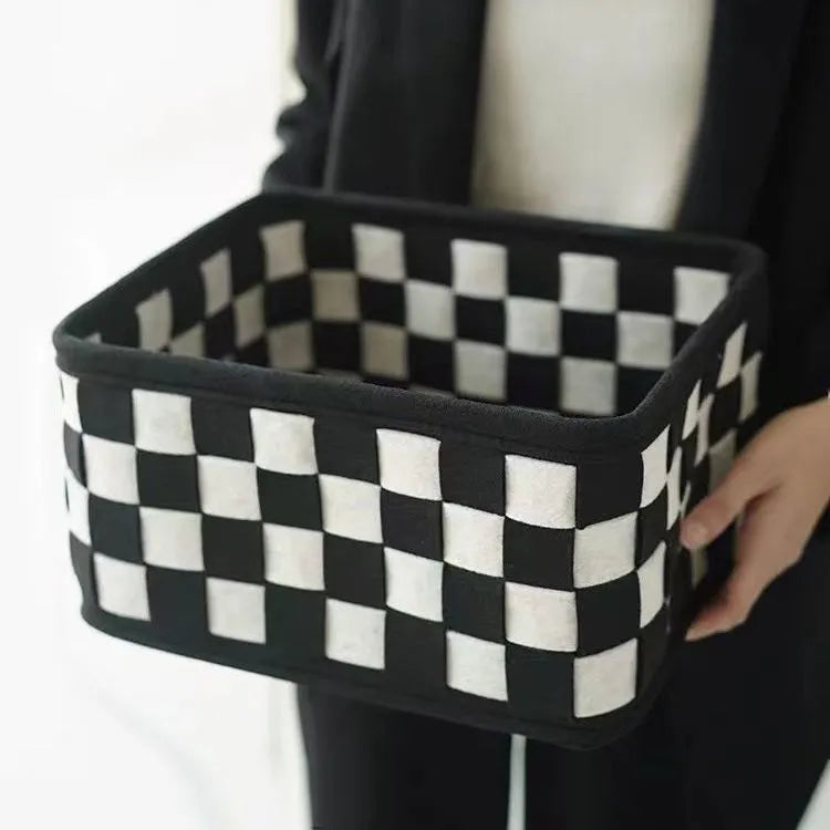 Grey checkerboard patterned felt storage basket with folded sides, showing its 37cm length.