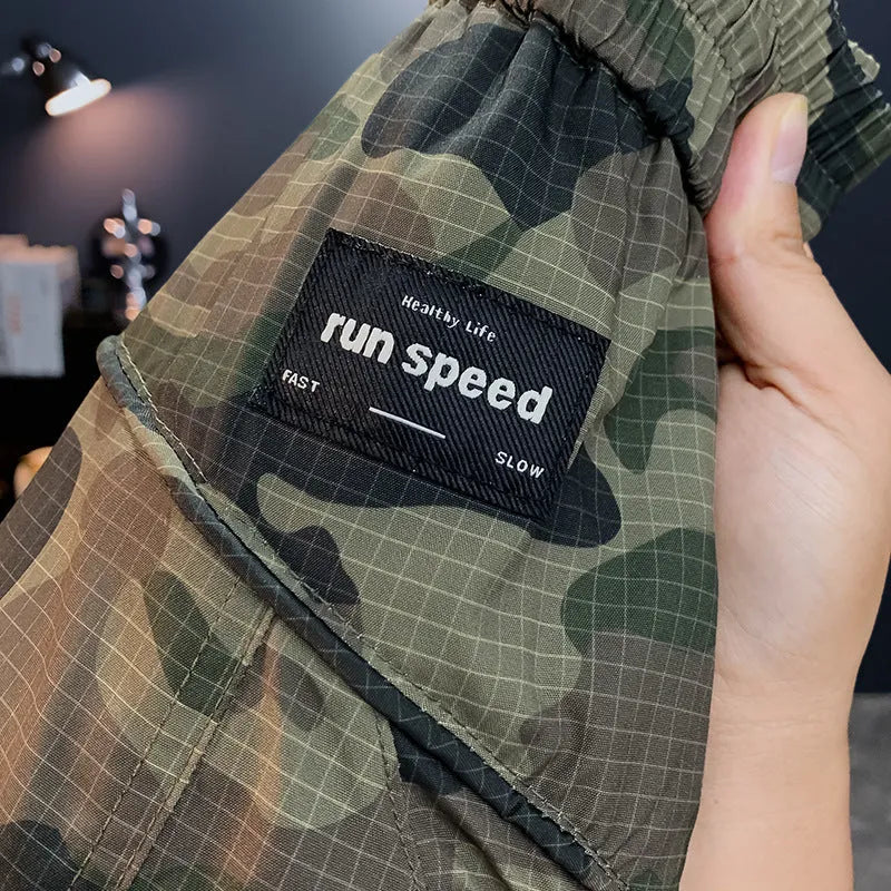 Man wearing loose-fit camouflage cargo shorts made from quick-dry cotton blend fabric