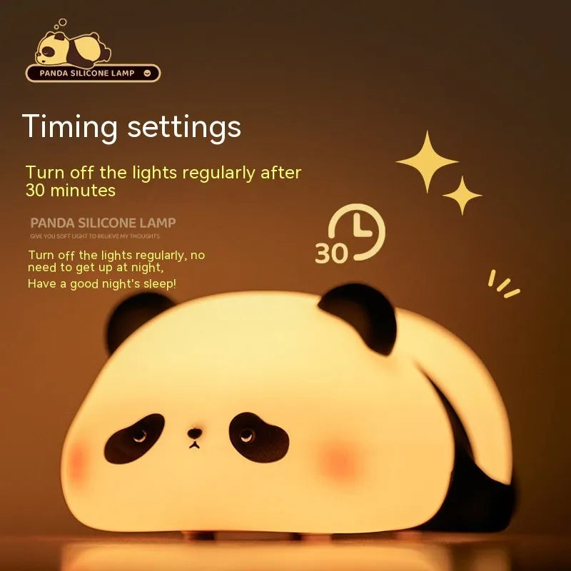 Panda-shaped silicone night light for kids on a bedside table