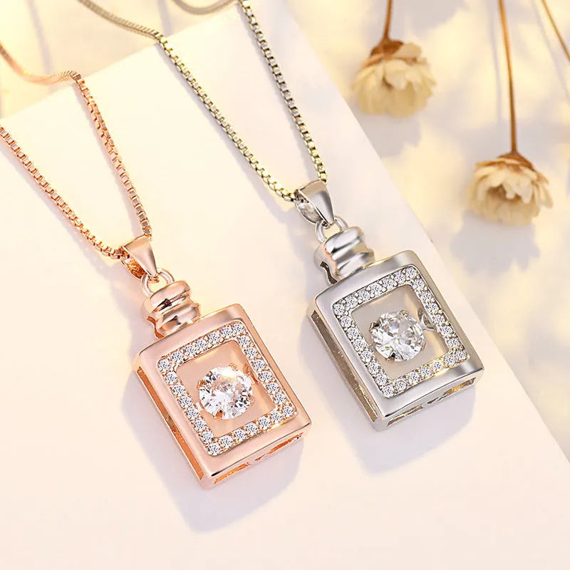 Sterling silver heart necklace with crown and bow details in rose gold or silver finish