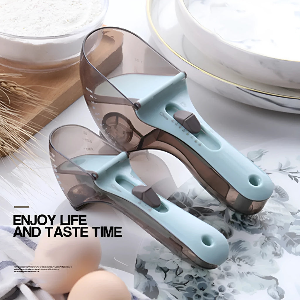Two magnetically nested digital measuring spoons in blue and orange on a kitchen surface