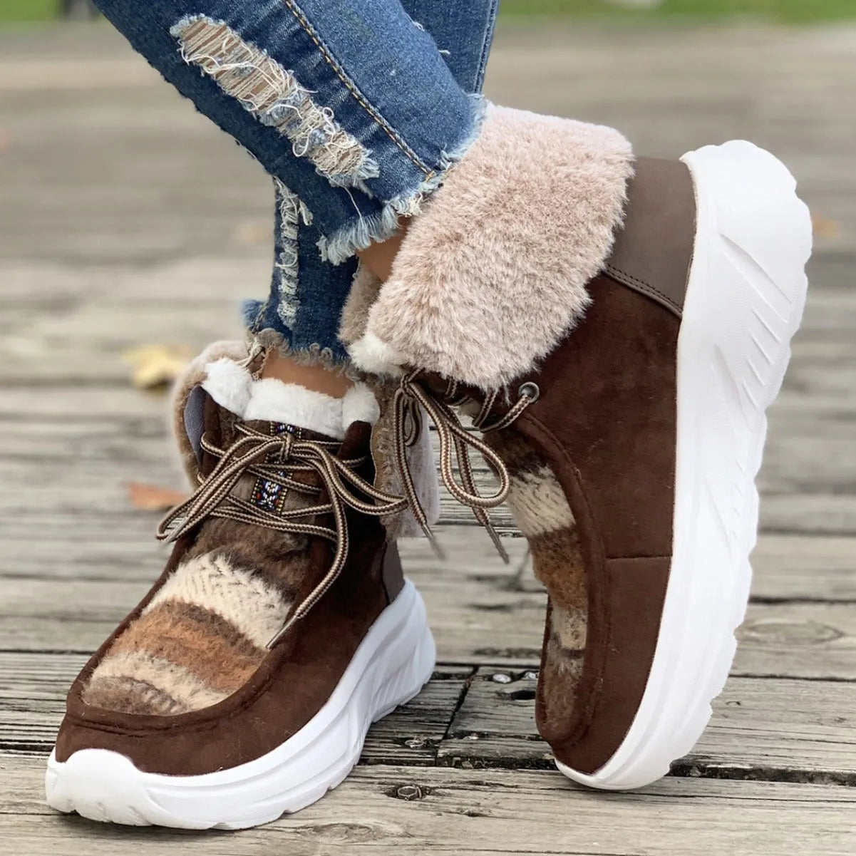Women's lace-up snow boots with fuzzy lining and non-slip rubber soles in beige, black, and brown colours