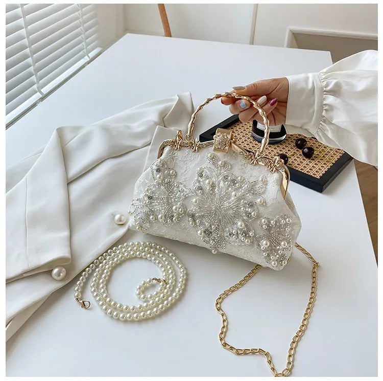 Pearl embroidered soft polyester handbag with double shoulder straps in floating light-white colour