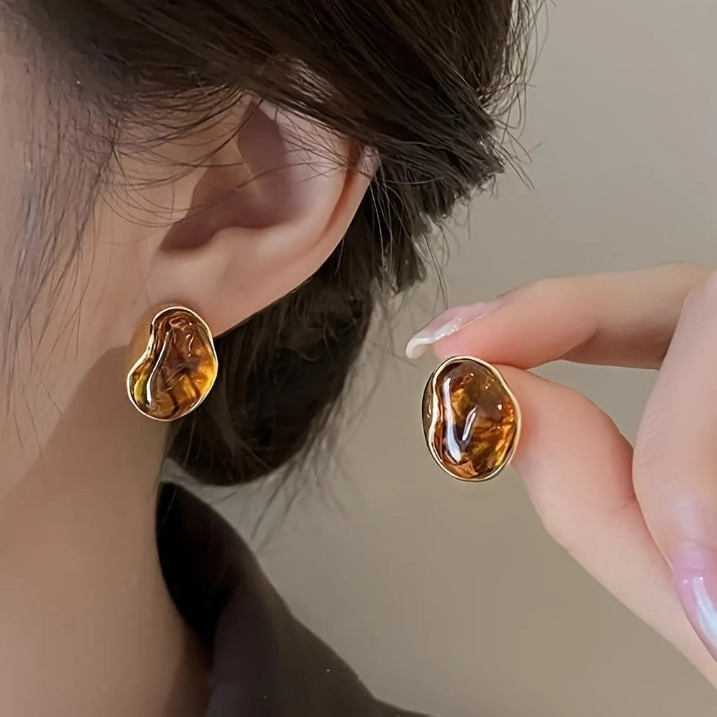 Three pairs of geometric tassel earrings with electroplated finishes in different styles