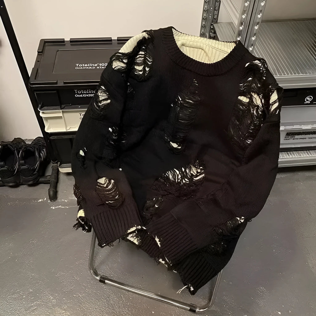 Men's black ripped sweater with animal pattern and tassels on front