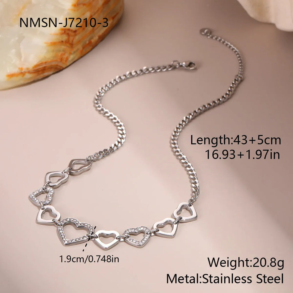 Geometric heart-shaped stainless steel pendant necklace with 18K gold finish on clavicle-length regular chain