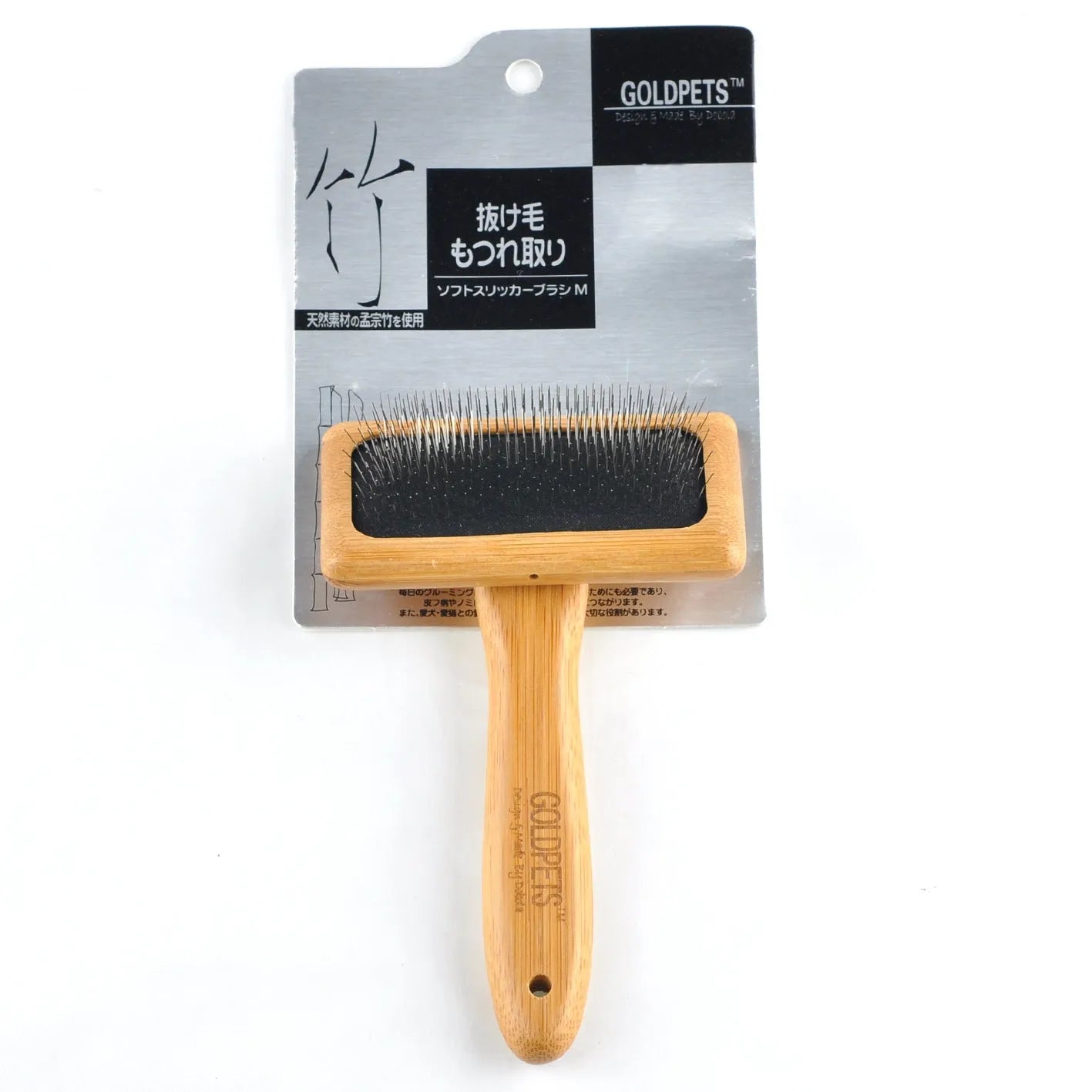 Pet grooming bamboo wood air cushion needle comb with original bamboo colour handle and steel pins on a clean background