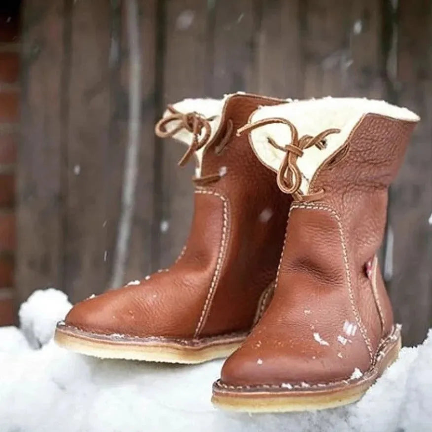 Women's winter snow boots with lace-up design, cotton lining, and non-slip rubber sole in a choice of colours