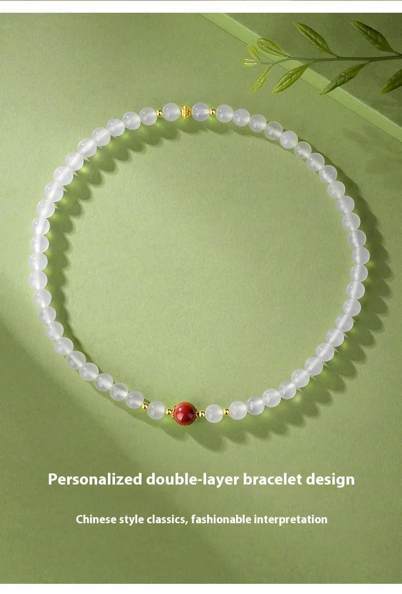 Women's white agate bracelet with cinnabar accents featuring 6mm geometry beads in double layer design