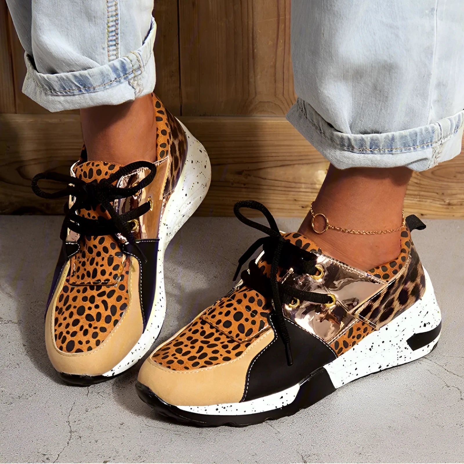 Women's casual suede sneakers with a wedge heel in black, leopard, pink, and snake pattern colours.