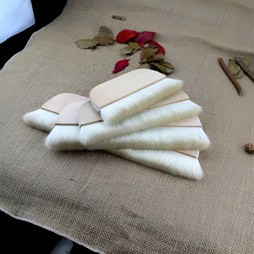 Natural wool brush for art mounting and shading craft projects in four size options.