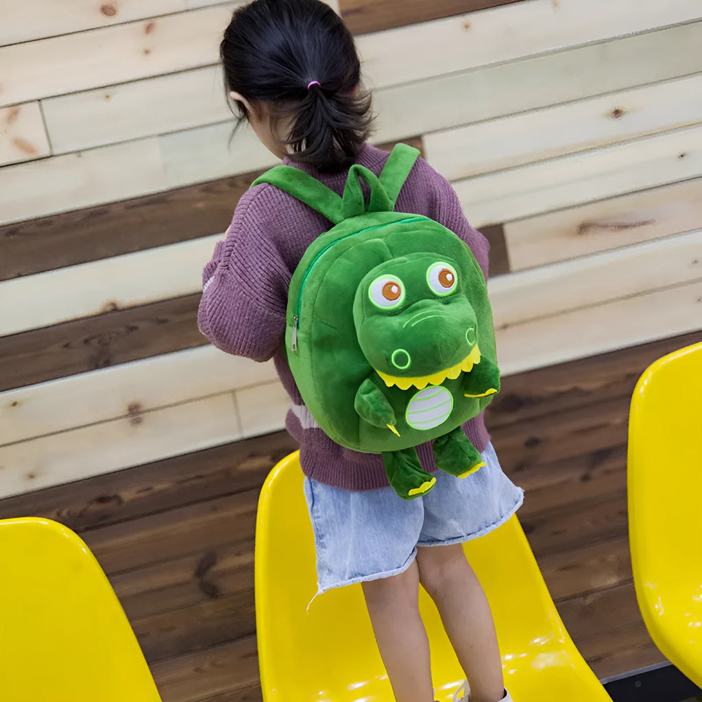 Blue dinosaur plush backpack for children with embroidery pattern and soft handles