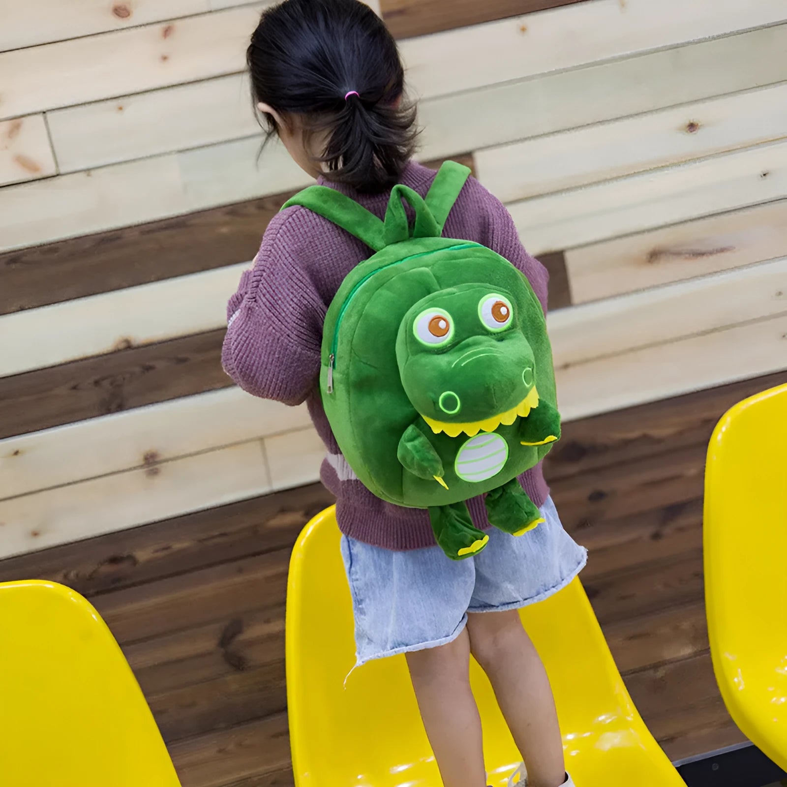 Blue dinosaur plush backpack for children with embroidery pattern and soft handles
