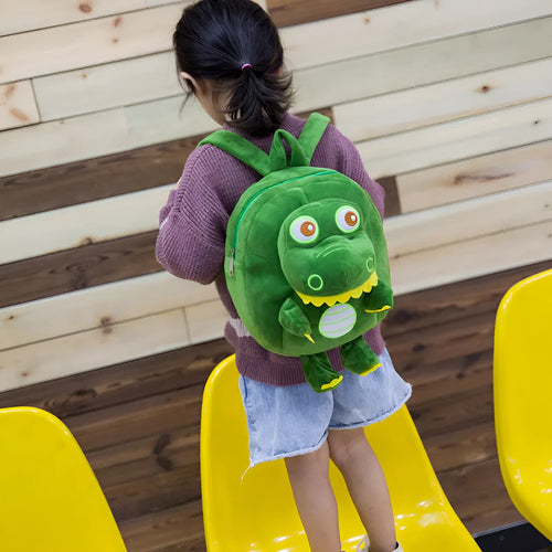 Blue dinosaur plush backpack for children with embroidery pattern and soft handles