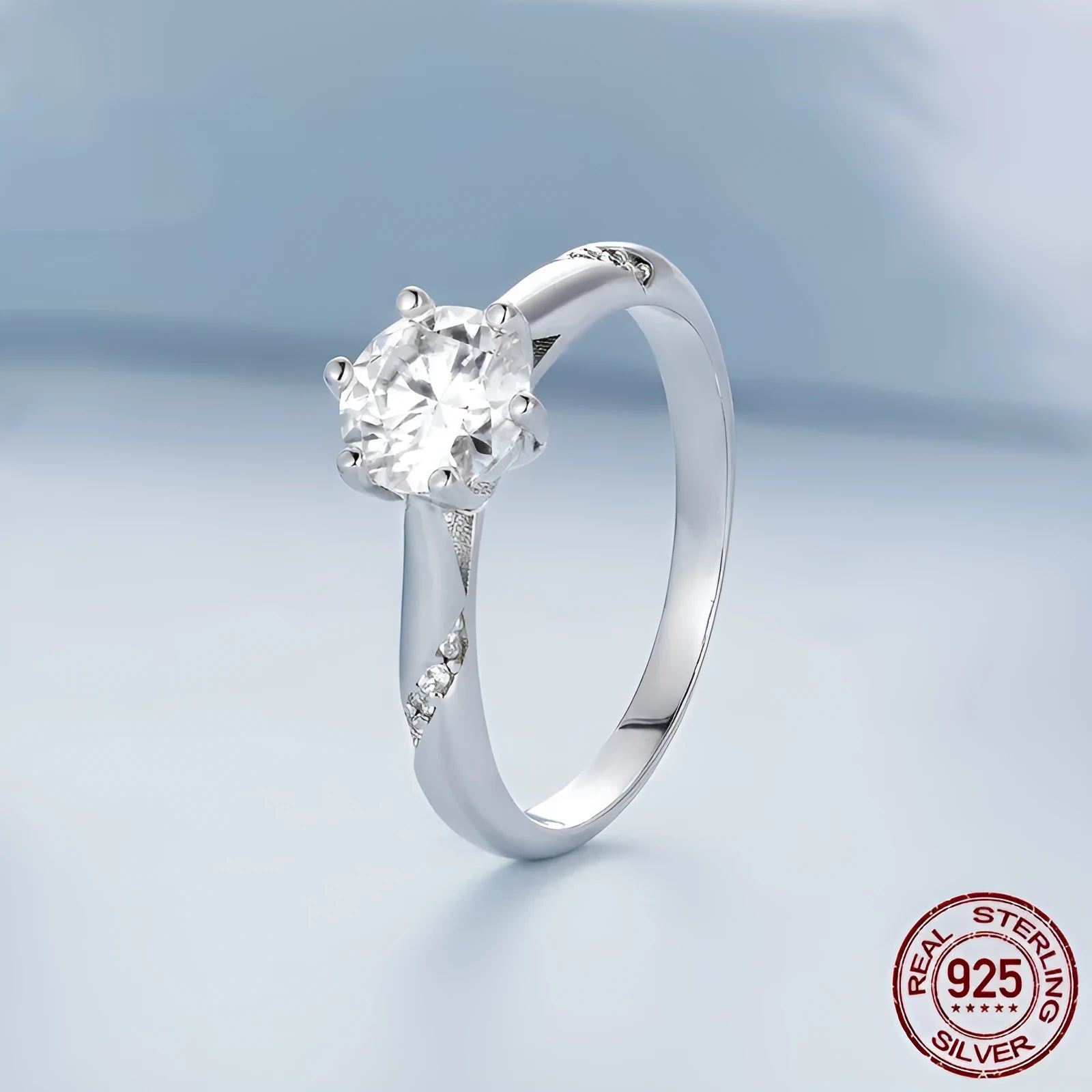 Silver moissanite ring with 1 karat main stone, electroplated finish, size US7 on a white background.