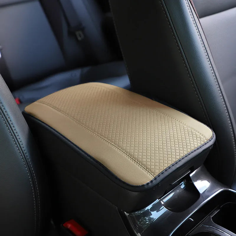 Black embossed PU leather car armrest box cushion mat measuring 32 by 19 centimetres.