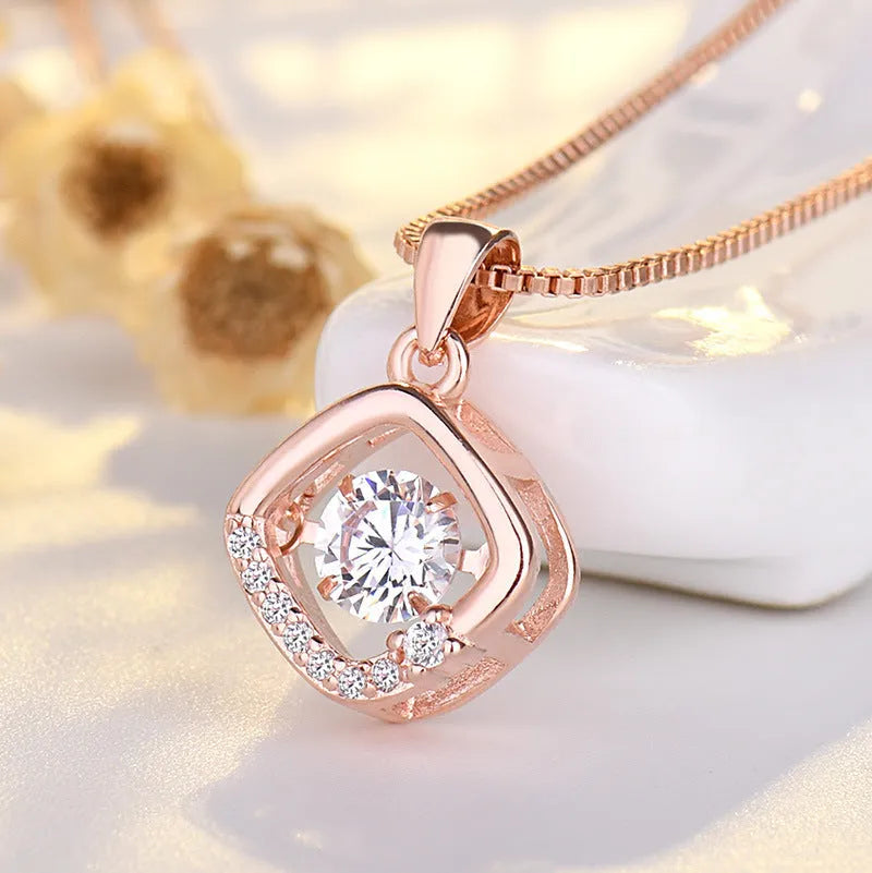 Sterling silver heart necklace with crown and bow details in rose gold or silver finish