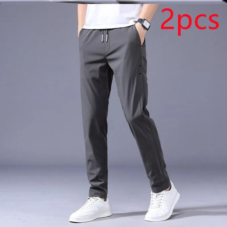 Men's drawstring trousers Korean version loose straight leg sweatpants in khaki colour on model
