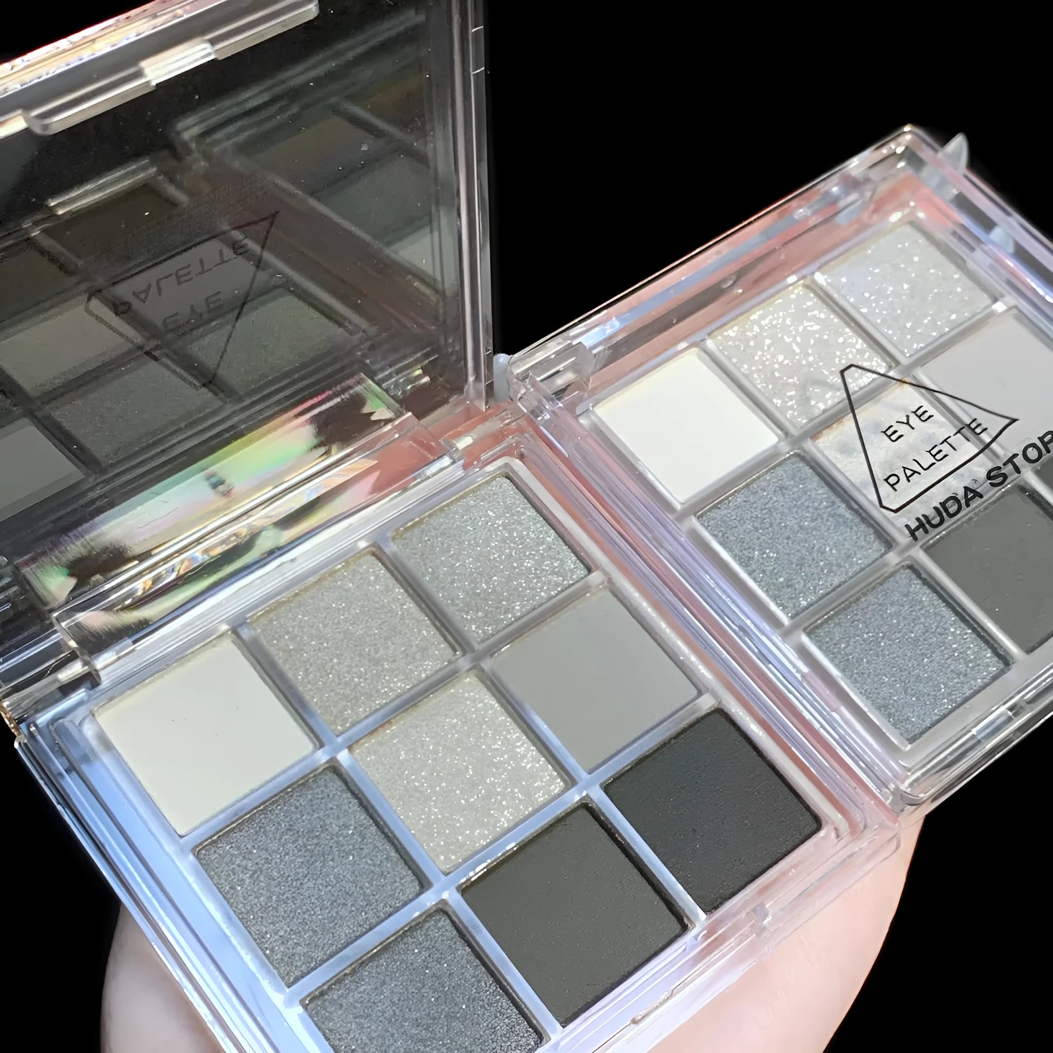 Smoked nine-colour eye shadow palette showing white, silver, black, and iron grey shades