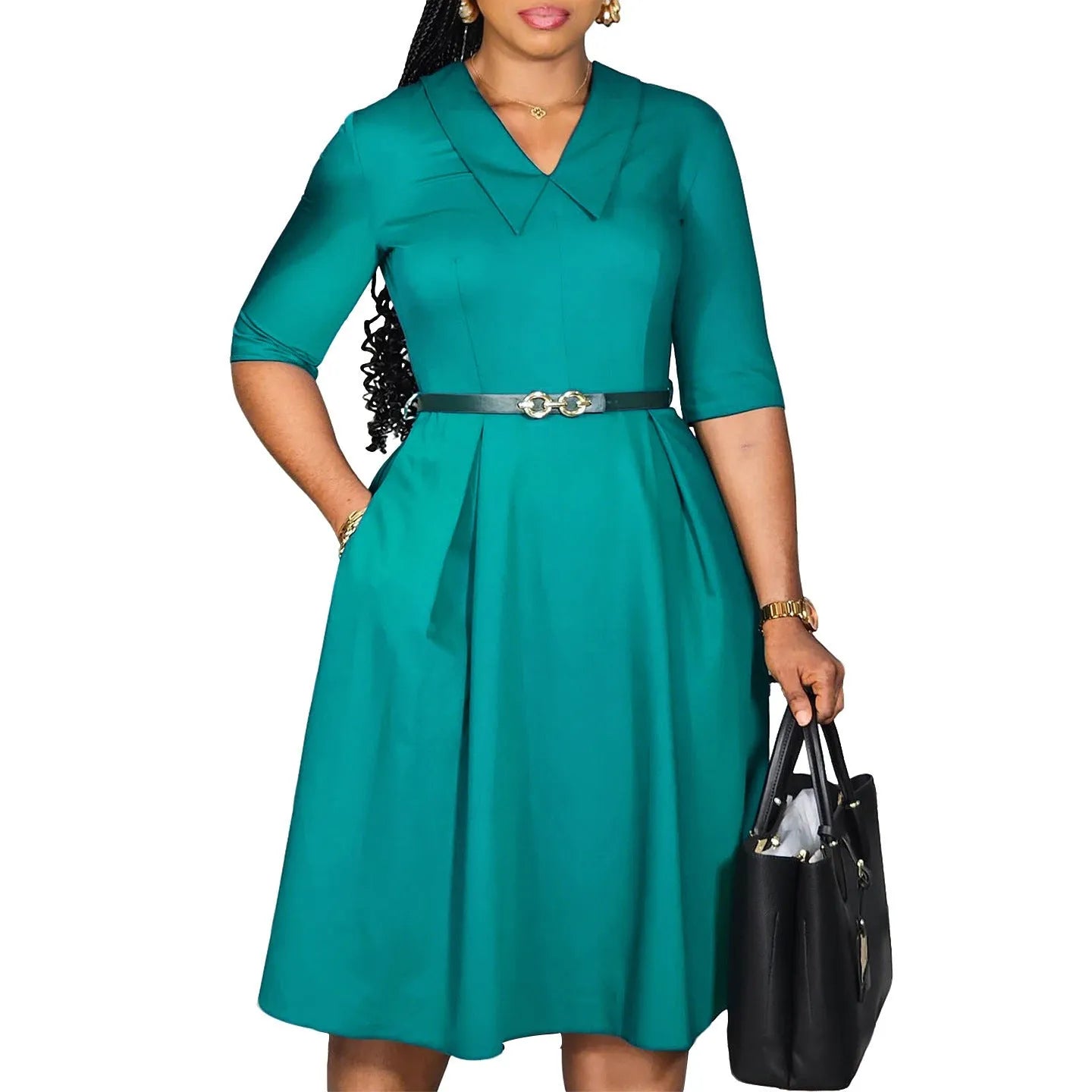 A woman wearing a solid colour African dress with half sleeves and a matching belt, showcasing the high-waist design.