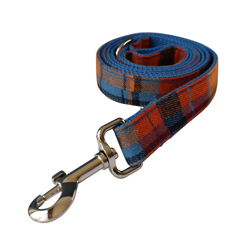 Blue background velvet plaid dog collar with a silver alloy buckle on a size tag.