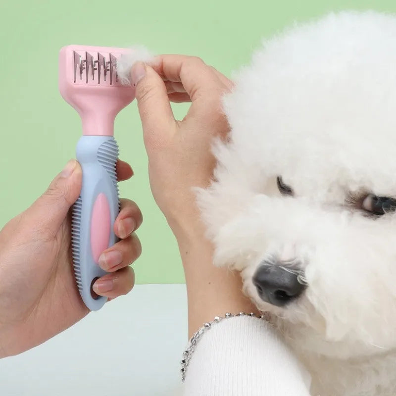 Pink stainless steel dog comb with integrated knot cutting blade for pet grooming