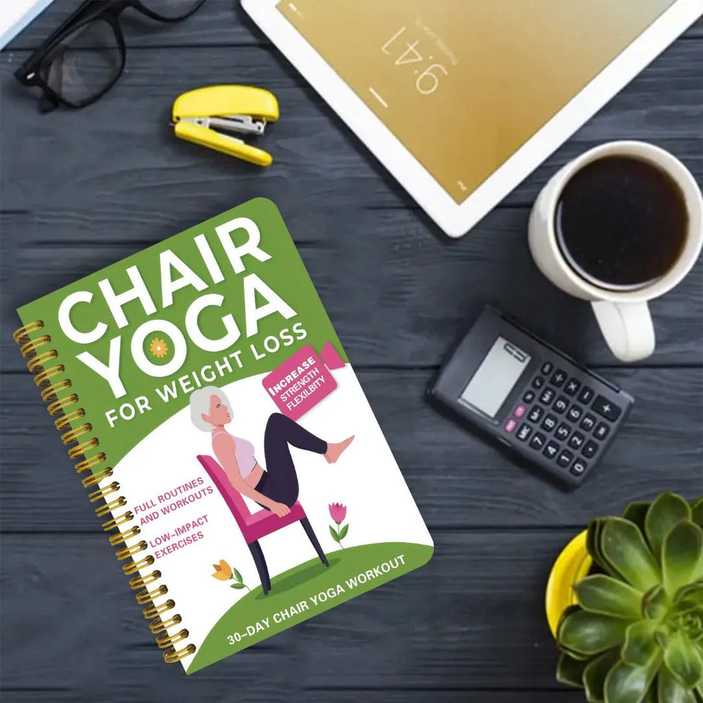 Green coil-bound notebook with 30 days chair yoga training guide content