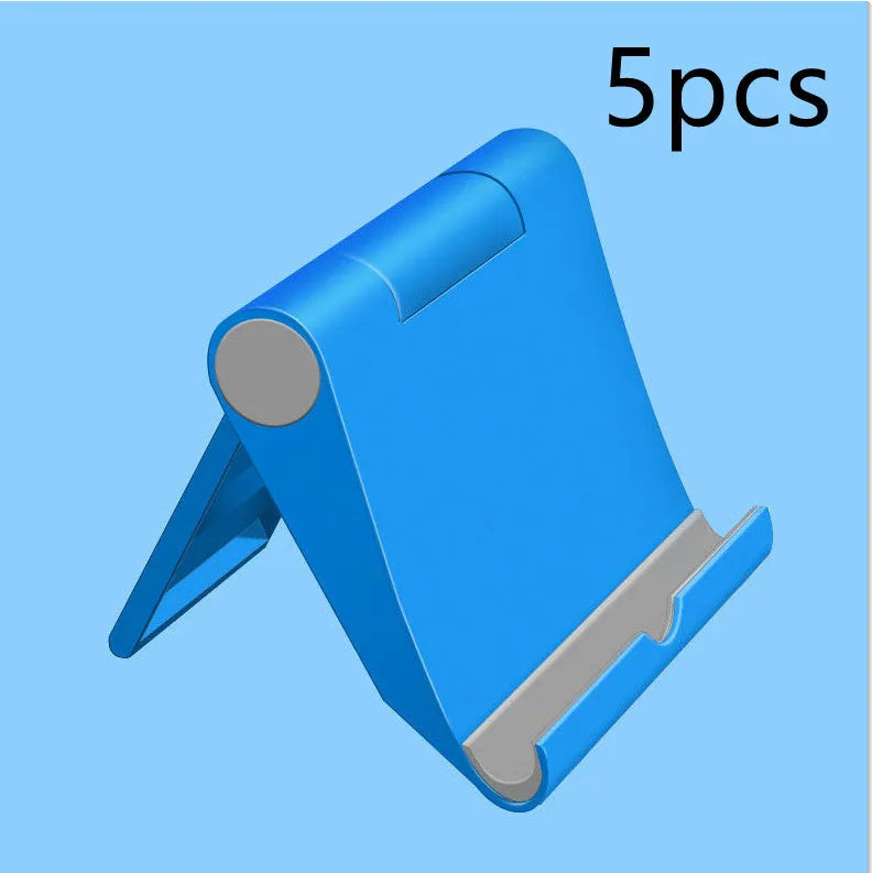 Black PE folding stand holding a smartphone at an angle on a wooden table.