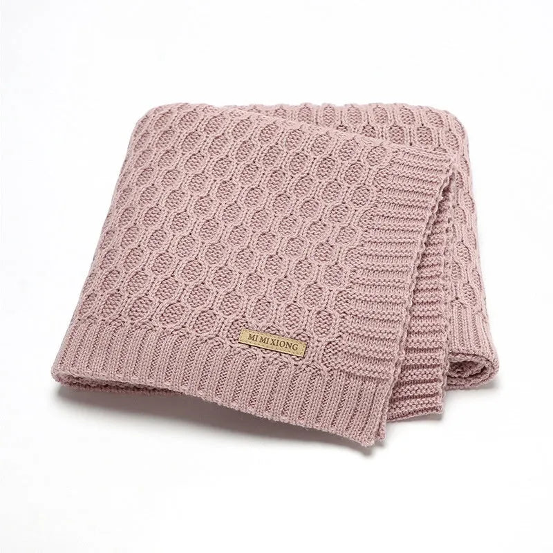 Solid colour infant blanket with raised line texture in beige khaki, laid flat showing 70x90cm size.