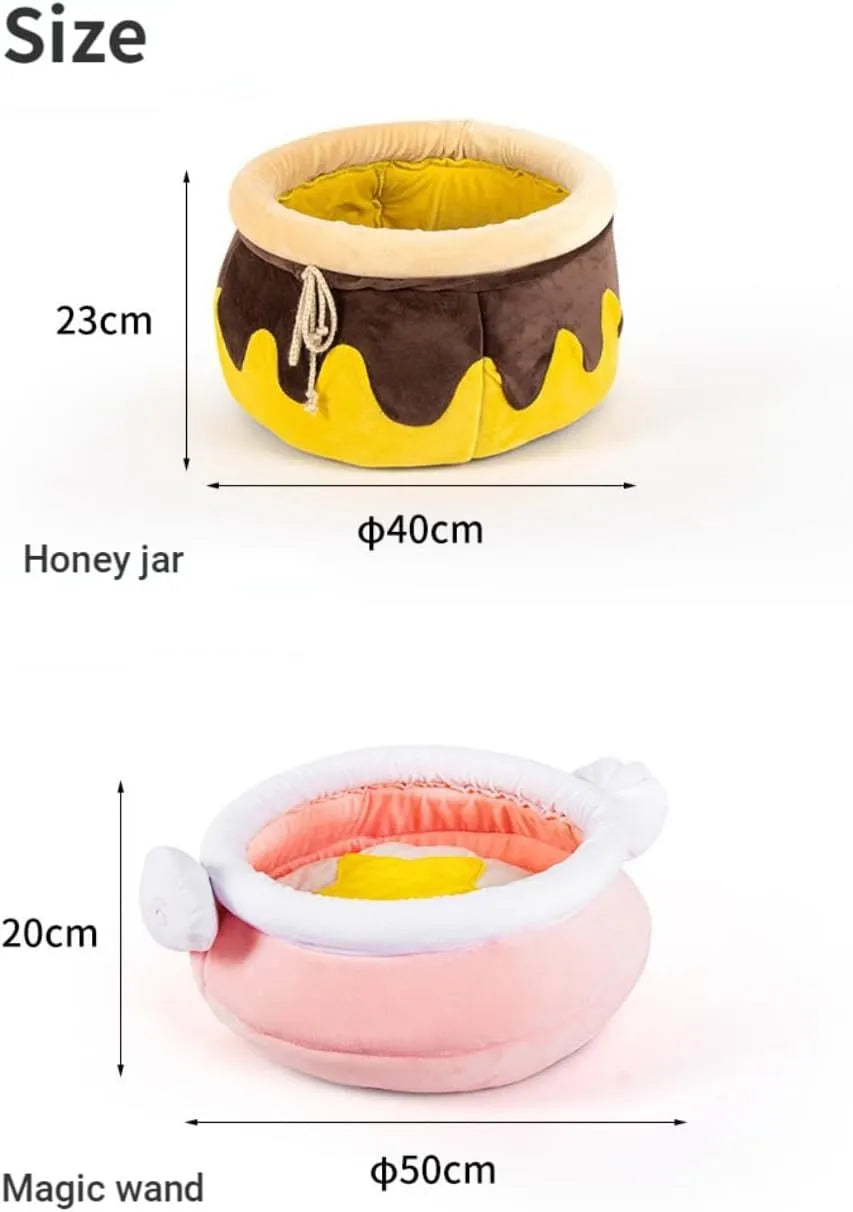 Pink honey pot shaped cat bed with a removable circular cushion inside for a small pet.