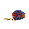 Four-piece dog fashion set showing collar, leash, bow tie and vest in coordinated cloth material