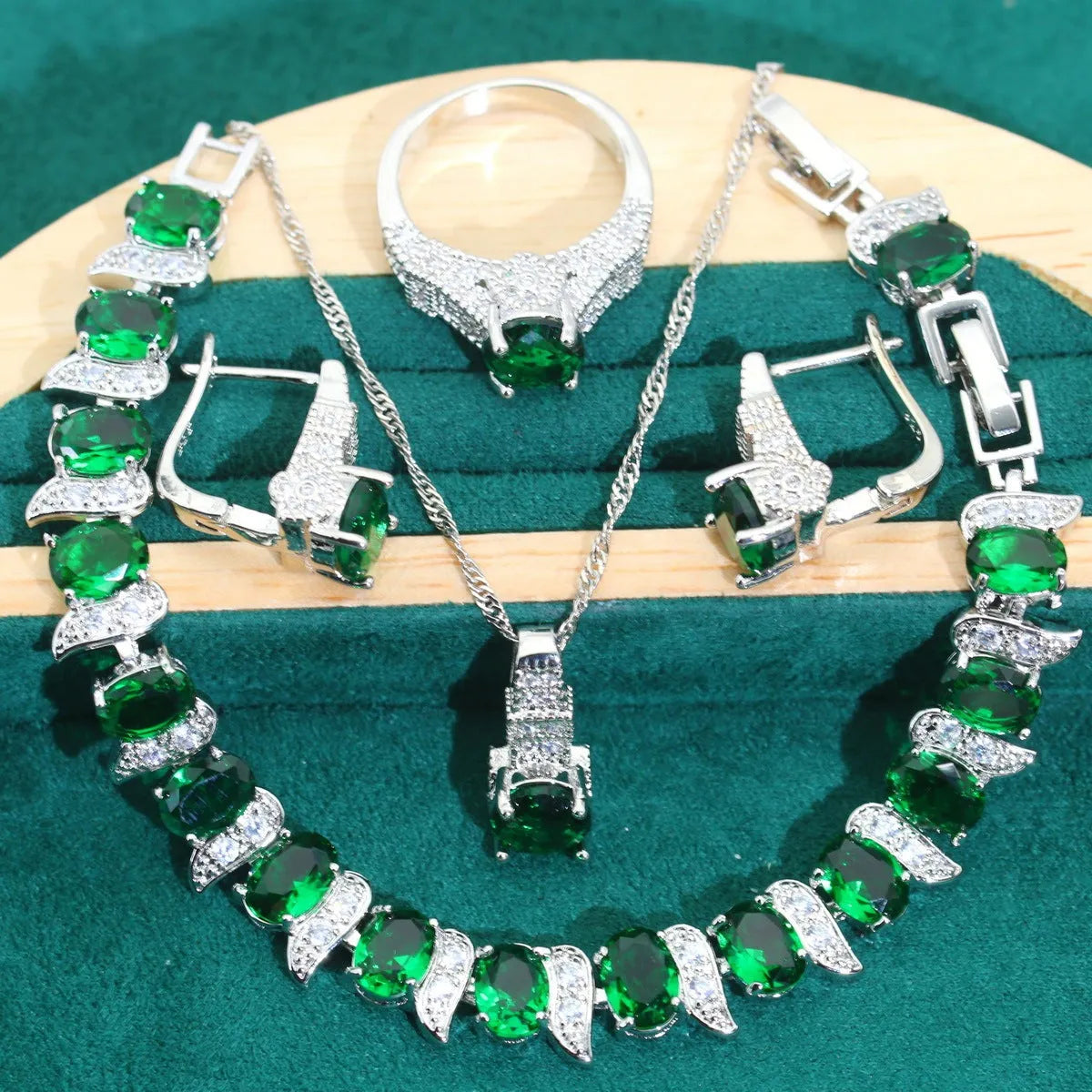 Bridal zircon alloy jewellery four-piece set showing necklace, earrings, ring and bracelet on water wave chain