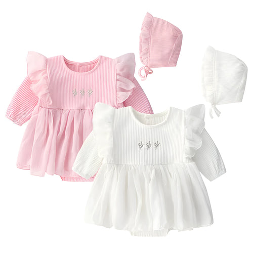 Baby girl in a soft pink cotton princess dress with a fluffy skirt, suitable for a first birthday party.