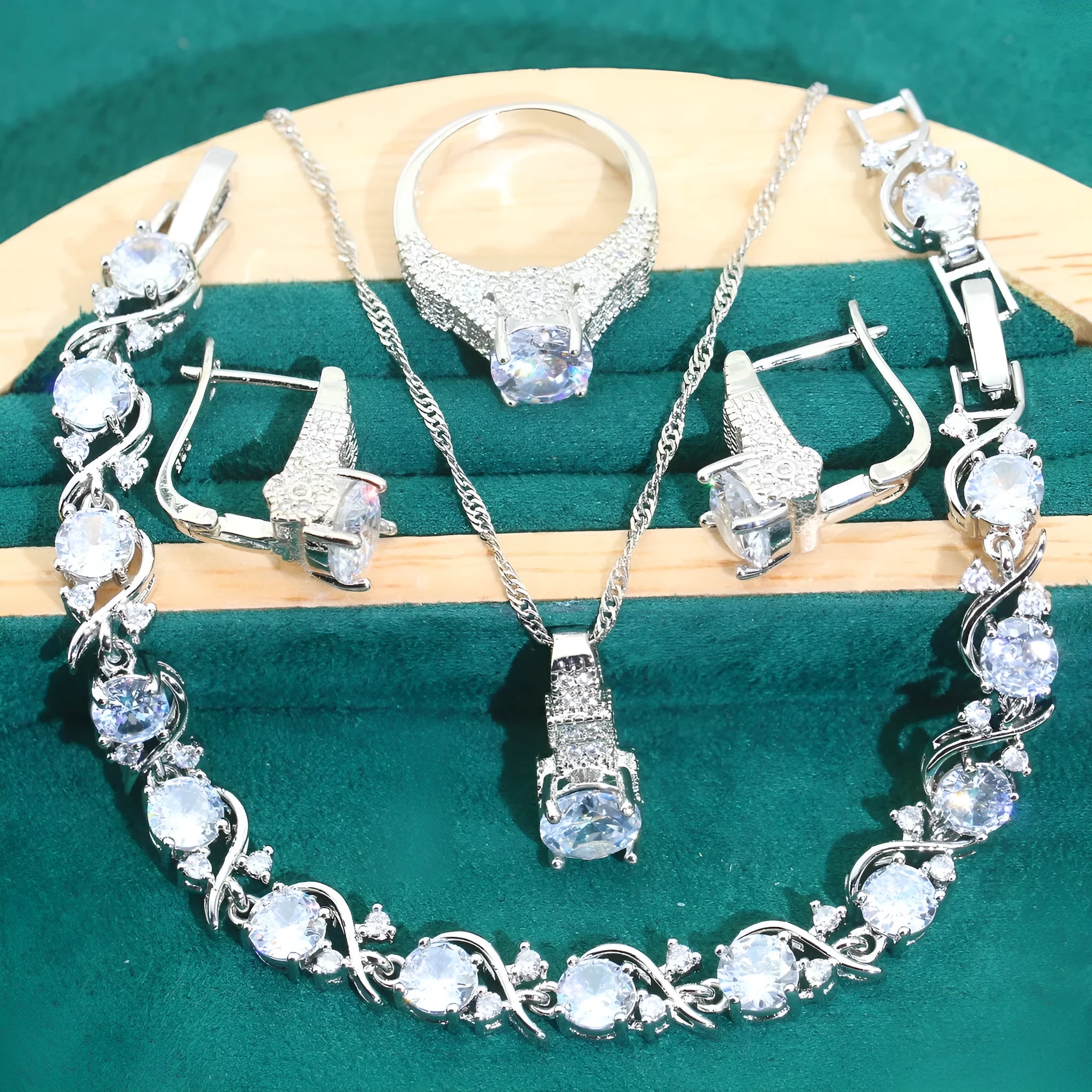 Bridal zircon alloy jewellery four-piece set showing necklace, earrings, ring and bracelet on water wave chain