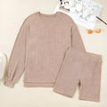 Dark khaki ribbed lantern sleeve sweater and motorcycle knit shorts set on woman