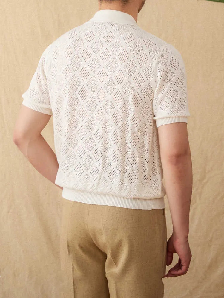 Light brown cotton short sleeve cardigan with a front zipper and lapel collar laid flat.