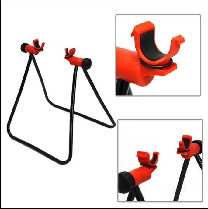 Foldable aluminium alloy bicycle repair rack in black with 3-way micro-adjustment and chain stay mounts on a flat surface