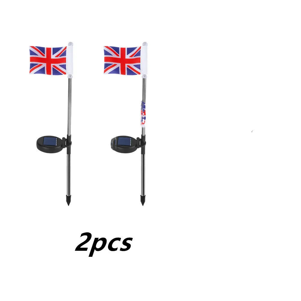 Solar-powered stainless steel garden flag light showing American flag design with white LEDs illuminated.