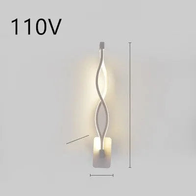 Minimalist Nordic design LED wall lamp with a silicone shade, mounted on a bedroom wall.