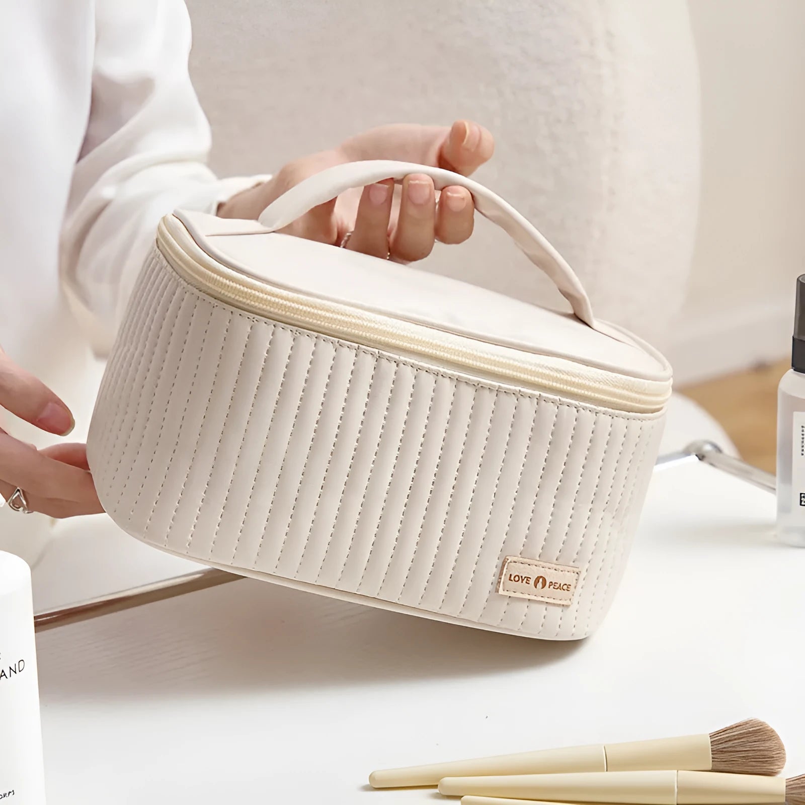 Open-top cake-shaped women's makeup bag in PU leather, shown in a soft solid colour.