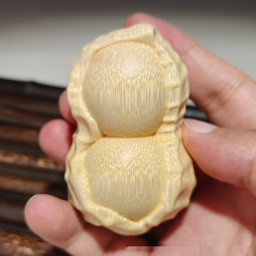 Natural solid bamboo peanut ornament with 'May Good Things Happen' engraved message.