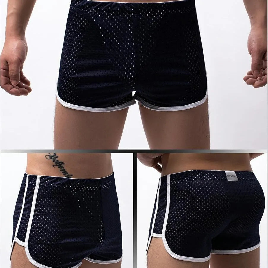 Men's black three-point boxer shorts made from a knitted cotton and nylon blend on a plain background.