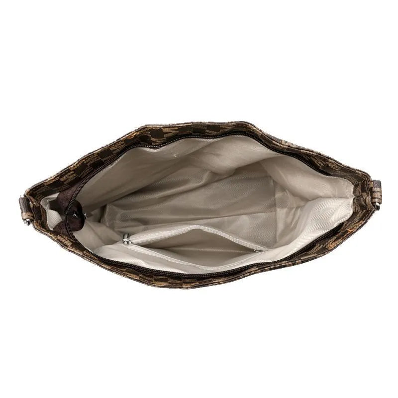 PU dumpling shape shoulder bag in black showing structured design with sandwich pocket