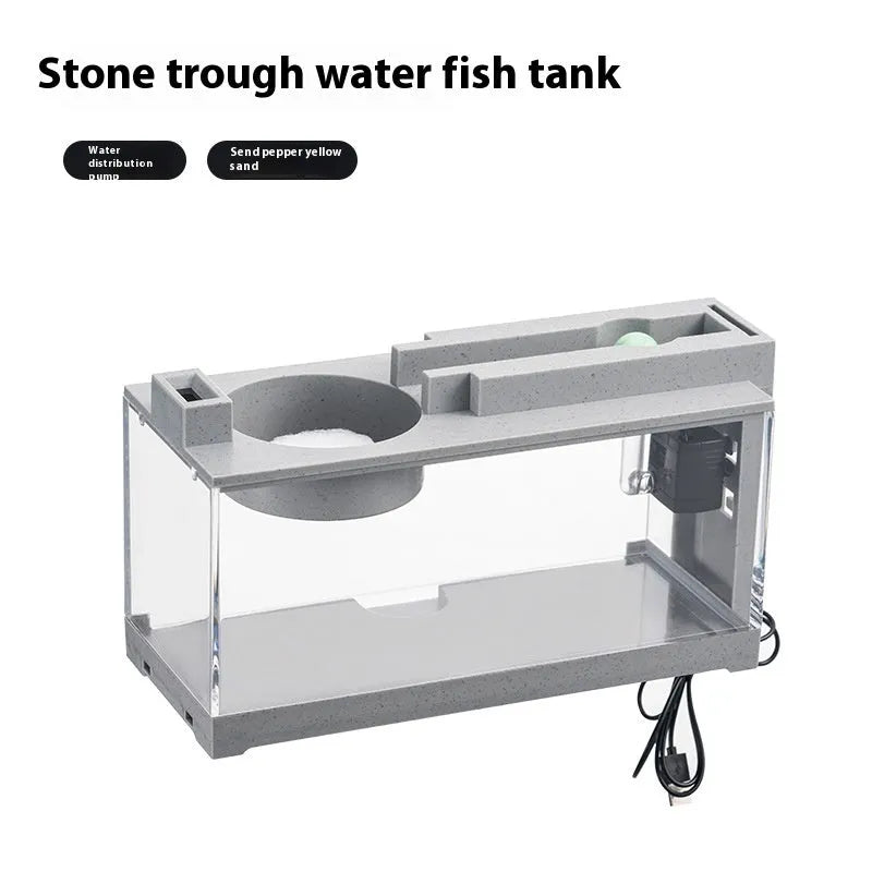 Small stone trough plastic fish tank with water pump and built-in light on a desk